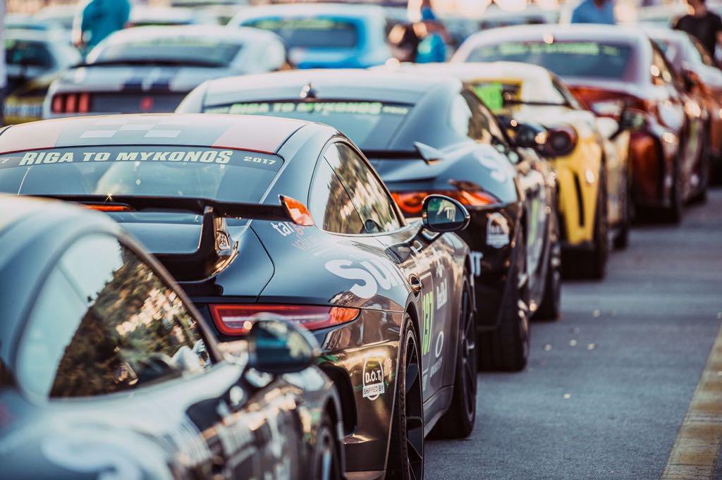 Porsche 911 on the Gumball 3000 rally grid, branded with The Sun